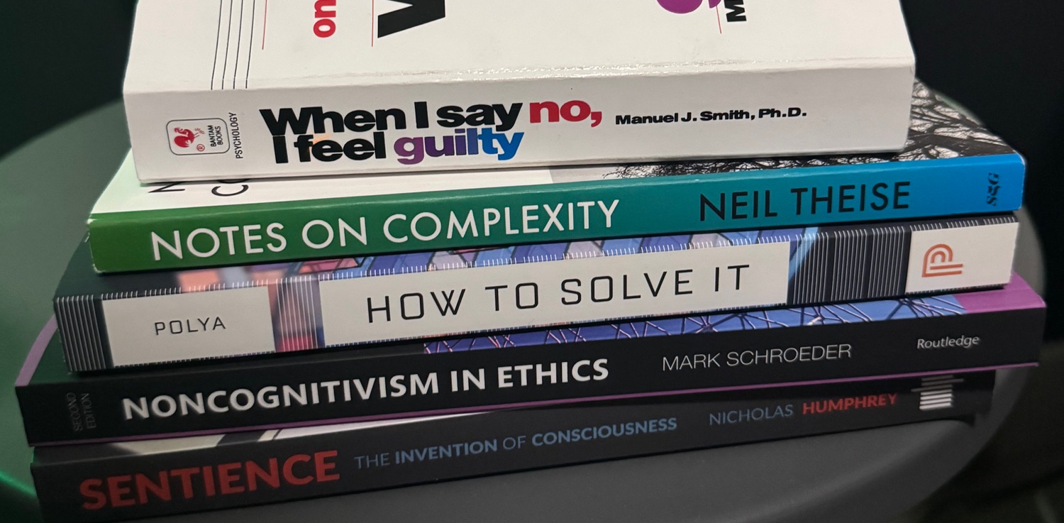 A series of books sitting on a coffee table