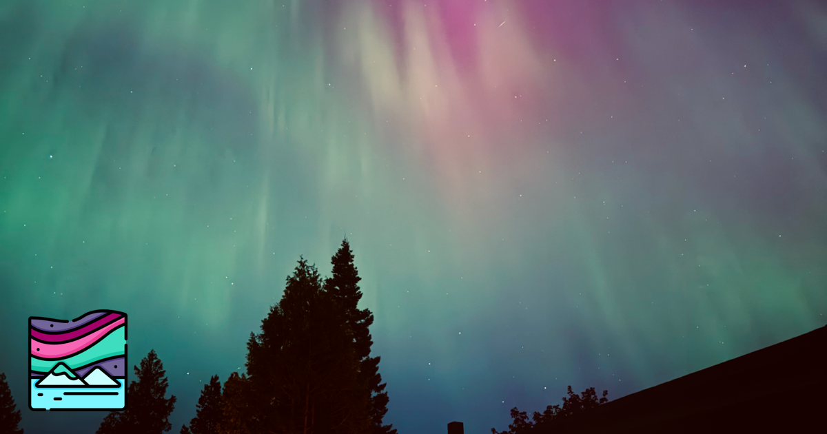 Aurora borealis over a house